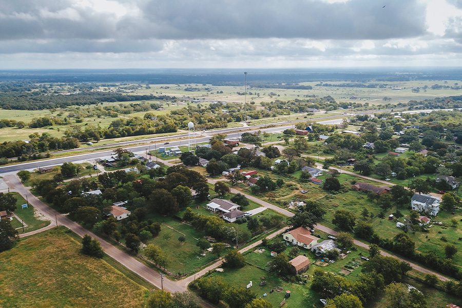 Bryan, TX - Aerial View of Small Rural Town with Open Land and Trees