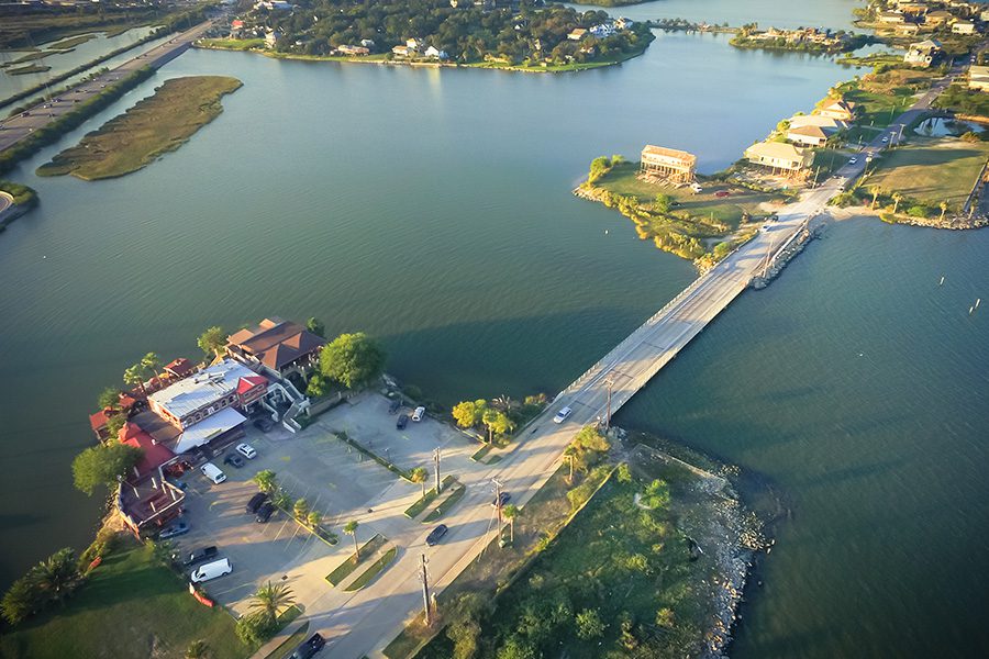 Seabrook, TX - Aerial View of Seabrook Showing off the Coast and Large Vacation Homes with Bridge Connecting Islands